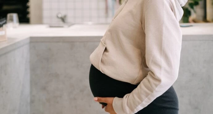 pregnant mom holding belly - curb walking to induce labor